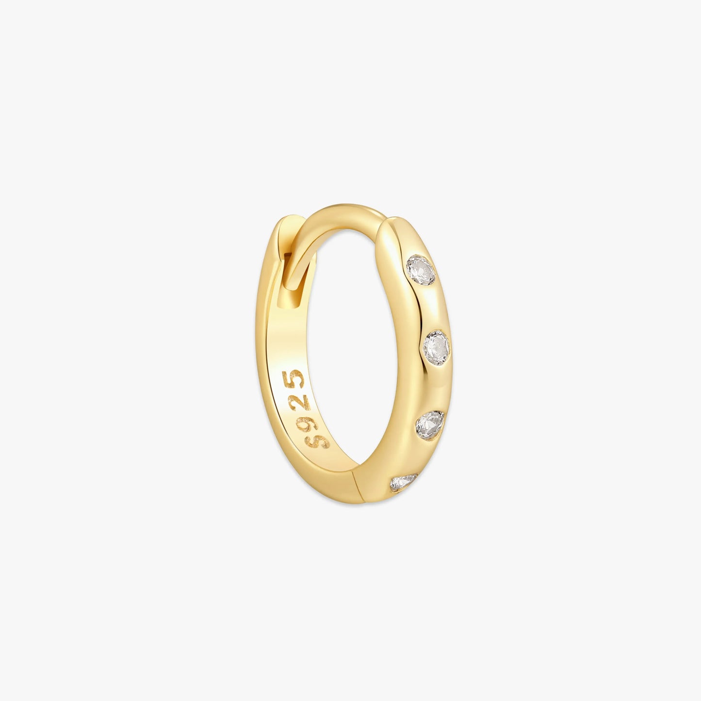 Gold hoop earring with small diamonds on a light gray background