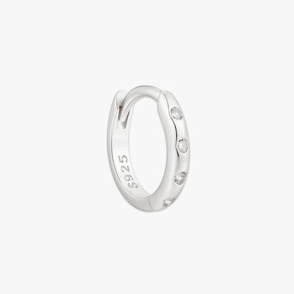 Silver hoop earring with '925' stamp on a light gray background