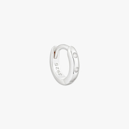 Silver hoop earring with '925' stamp on a white background