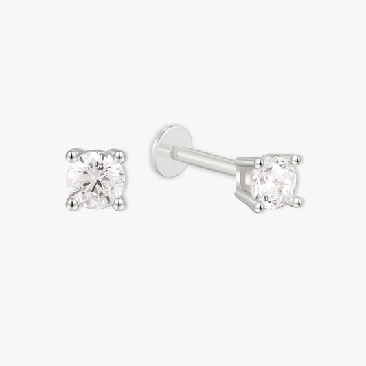 Pair of diamond stud earrings on a white background