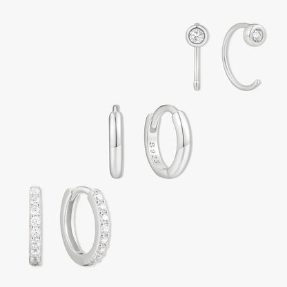 Set of silver hoop earrings on a white background