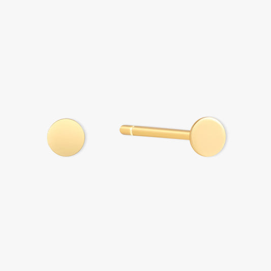 Gold stud earring on a white background