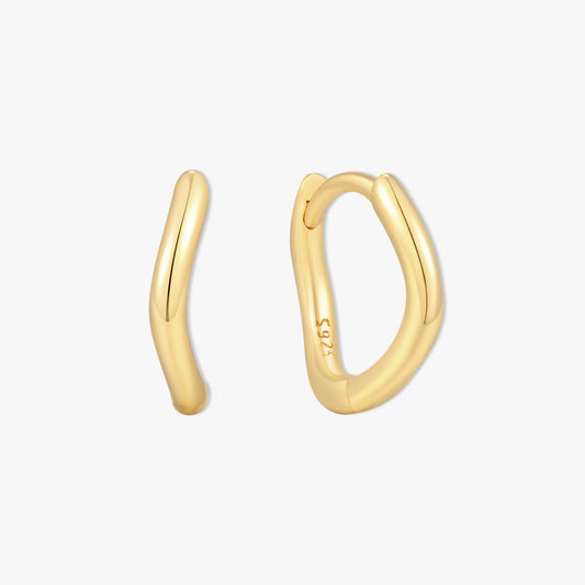 Gold hoop earrings on a white background