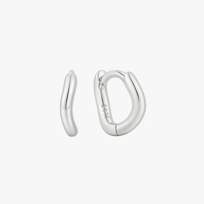 Pair of silver hoop earrings on a white background