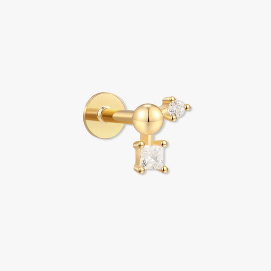 Gold earring with a diamond on a white background