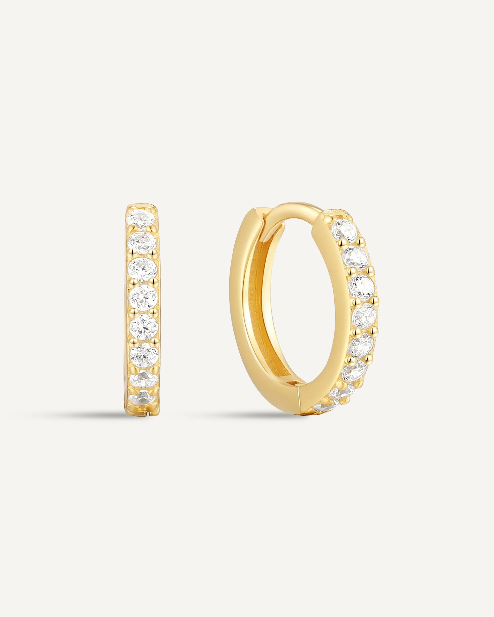 Crystal Paved Huggie Hoops In Gold