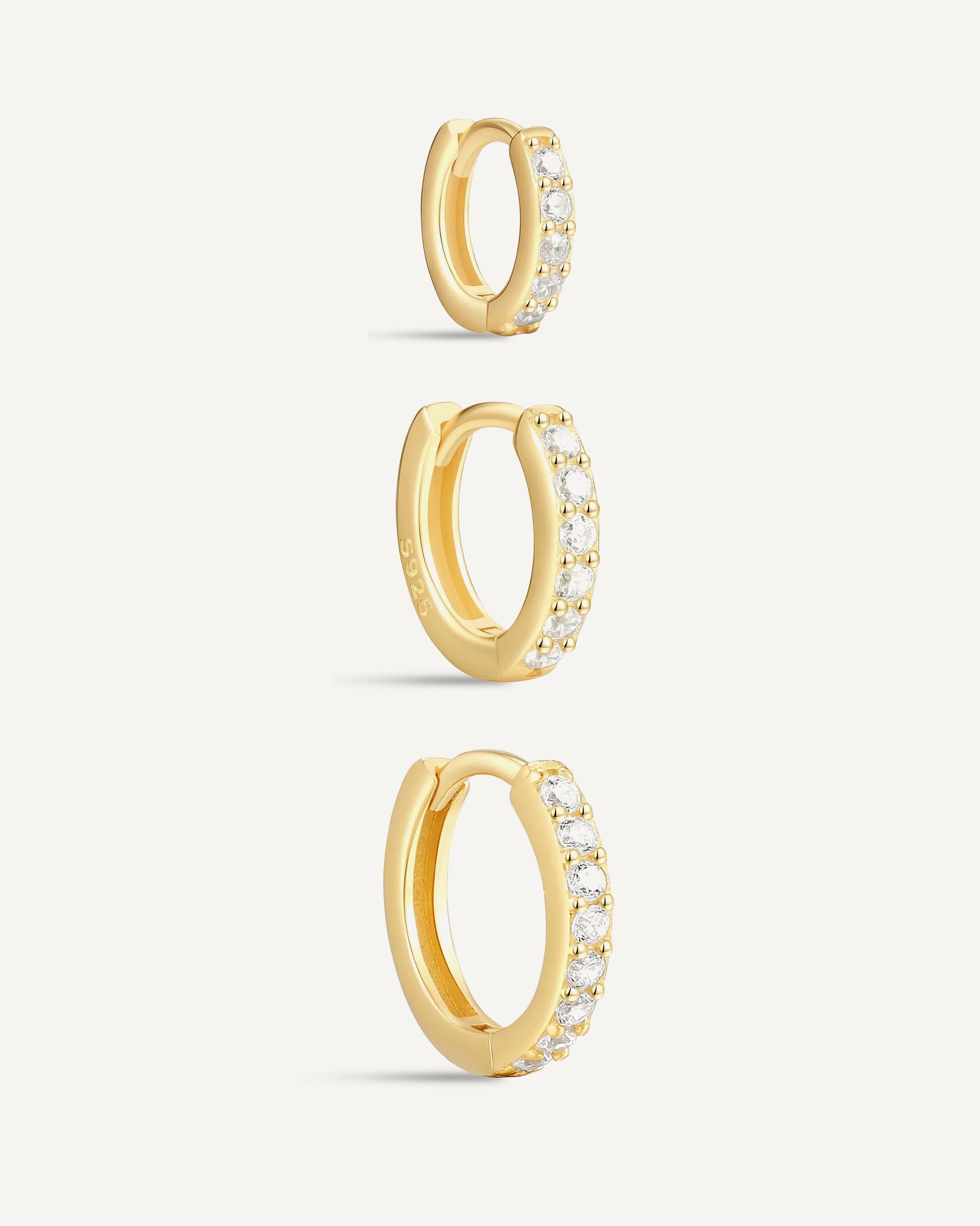 Crystal Paved Huggie Hoops In Gold