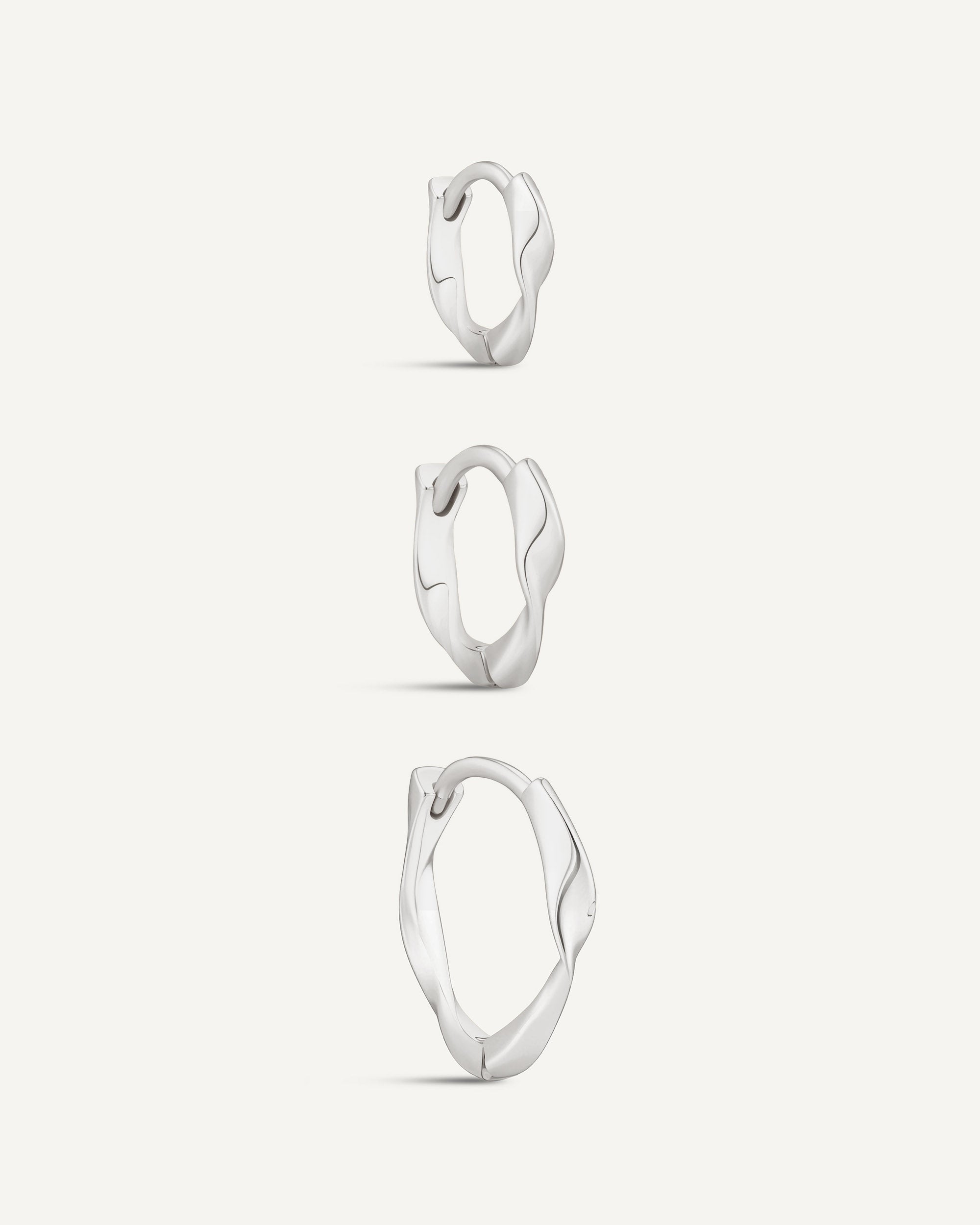 Twisted Huggie Hoops In Silver