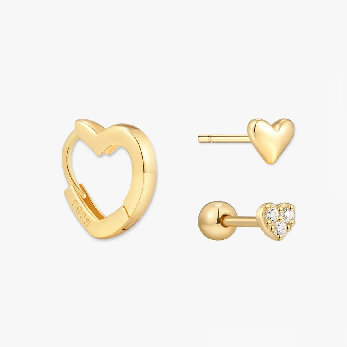 Gold heart-shaped earrings on a white background
