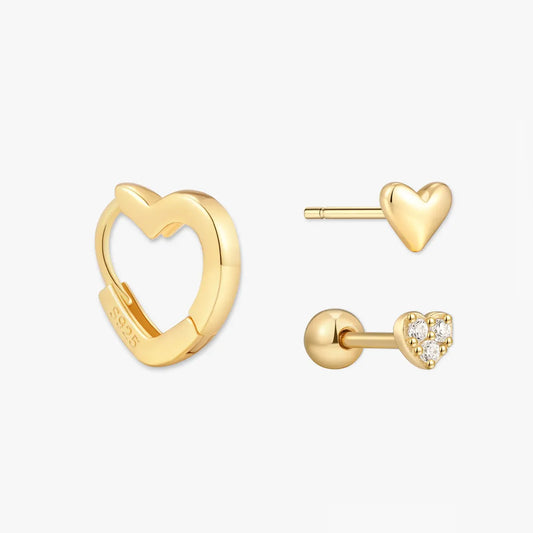 Gold heart-shaped earrings on a white background