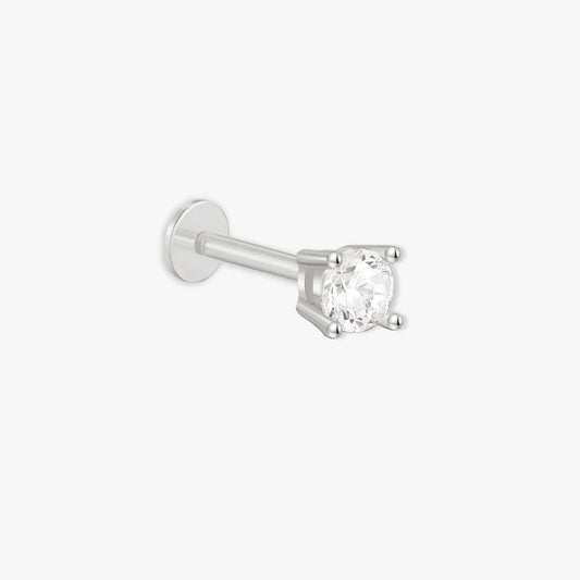 Single stud earring with a clear gemstone on a white background