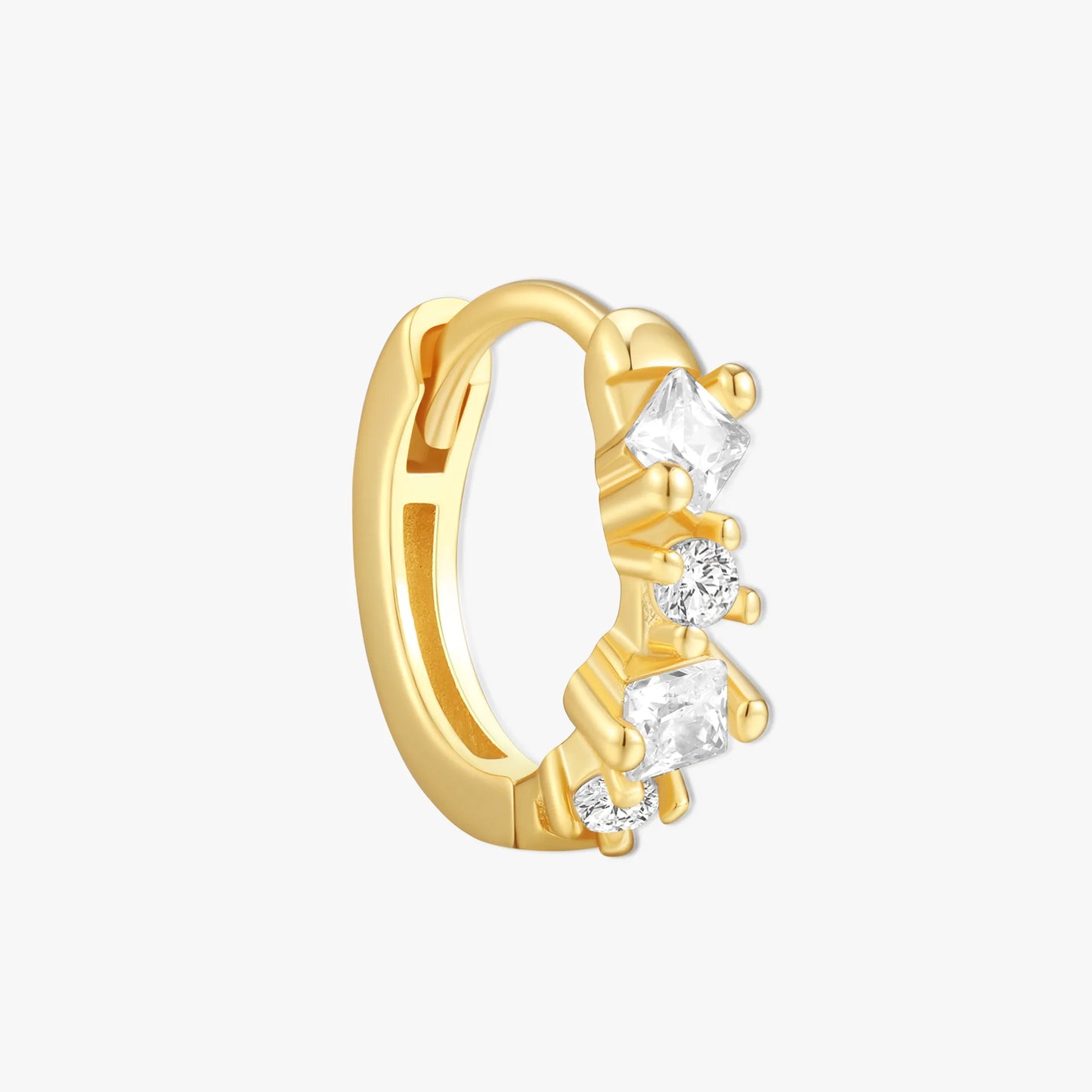 Gold hoop earring with clear gemstones on a white background