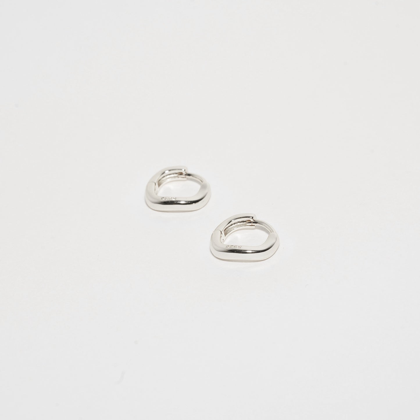 Sculpted Wavy Huggie Hoops In Silver