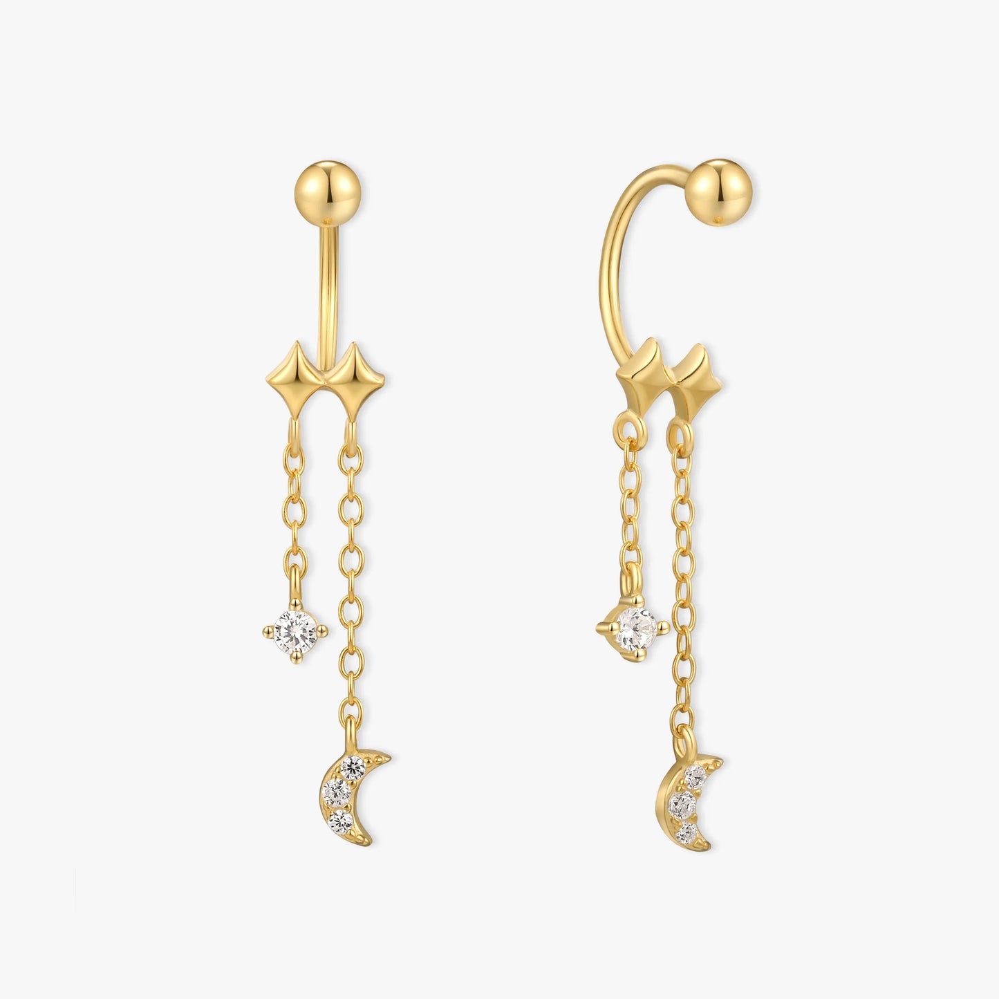 Gold ear cuffs with star and moon charms on a white background