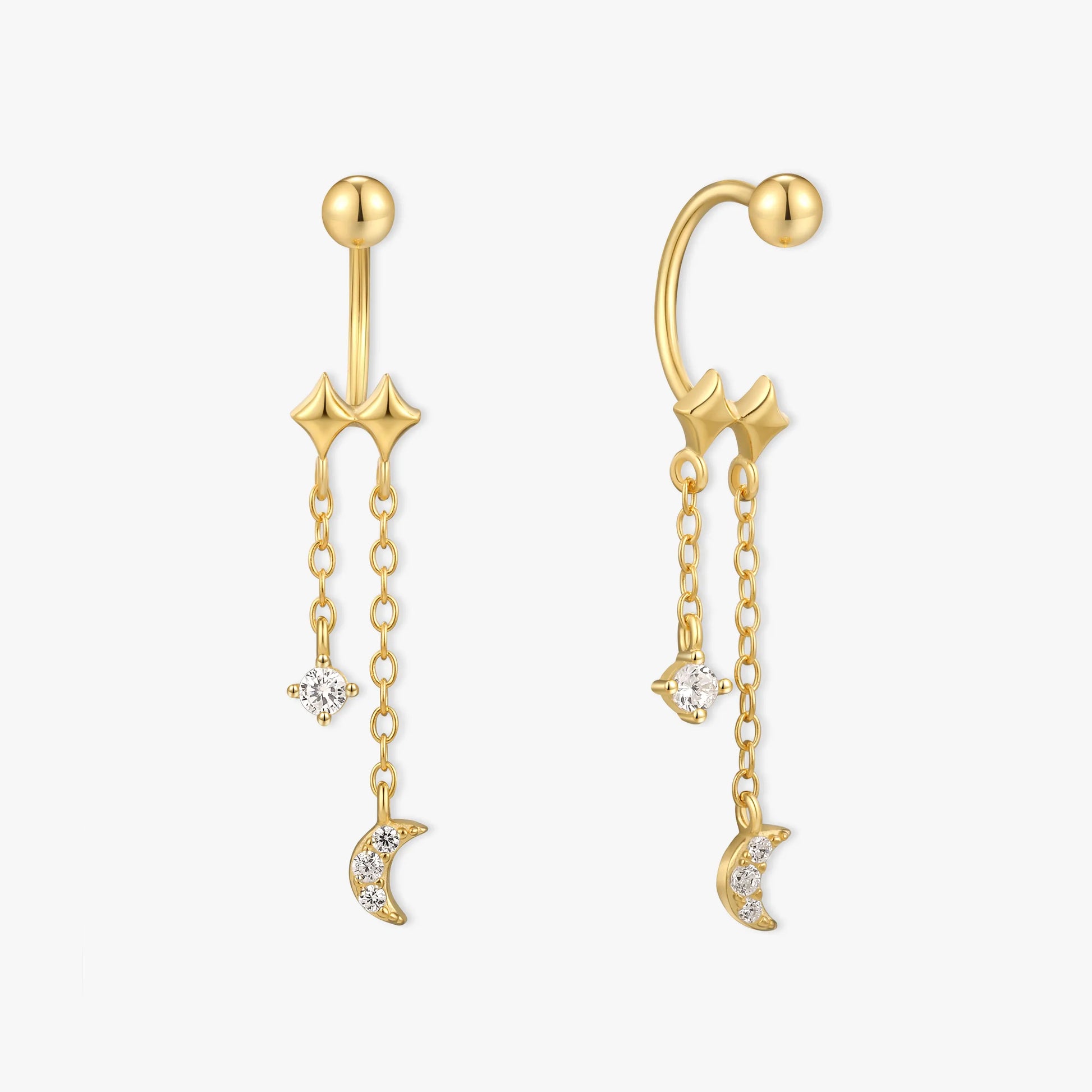 Gold ear cuffs with star and moon charms on a white background
