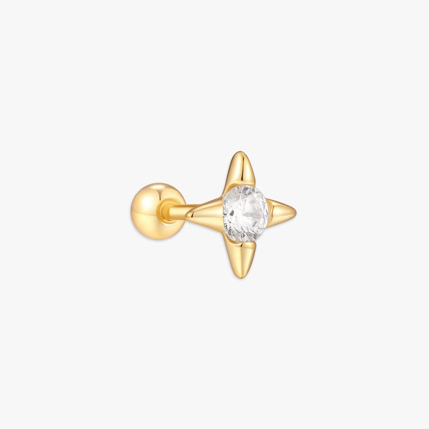 Gold earring with a star-shaped design and clear gemstone on a white background
