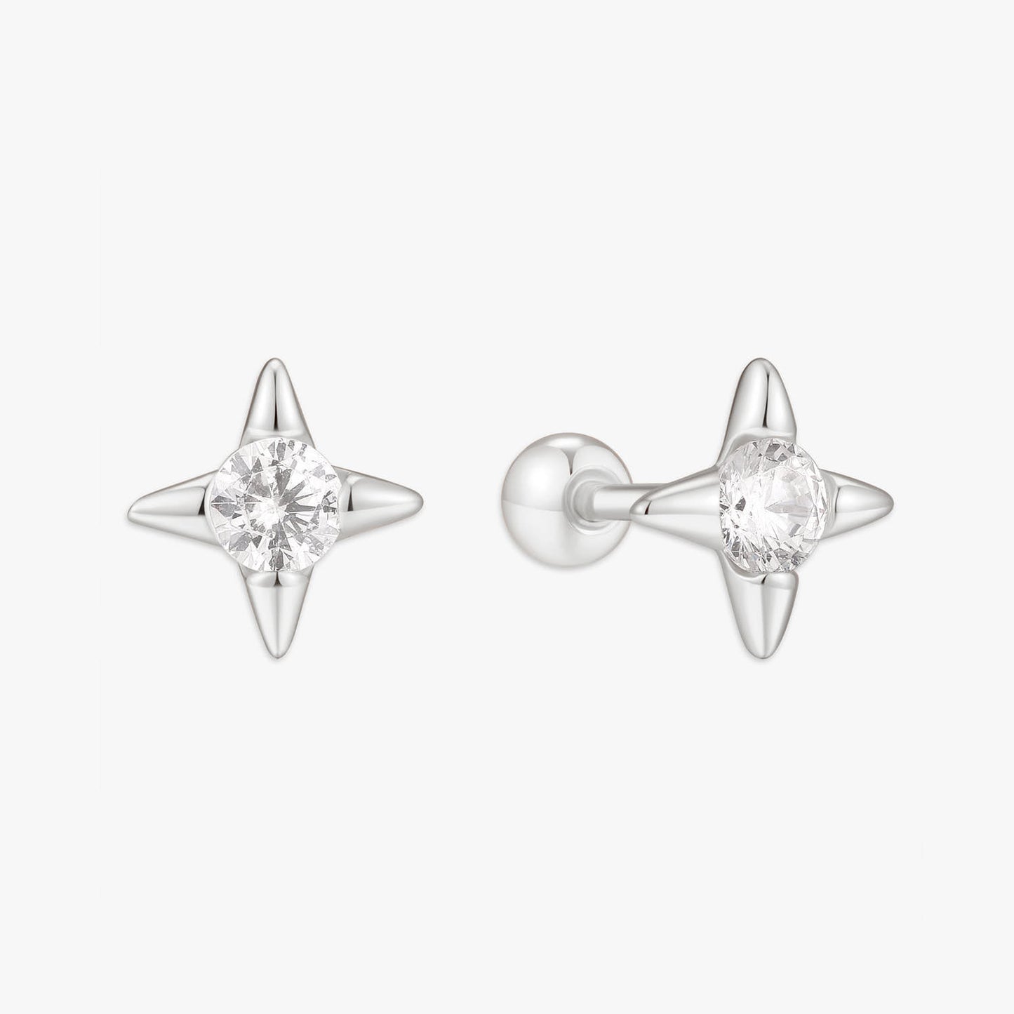 Star-shaped silver earrings with clear gemstones on a white background
