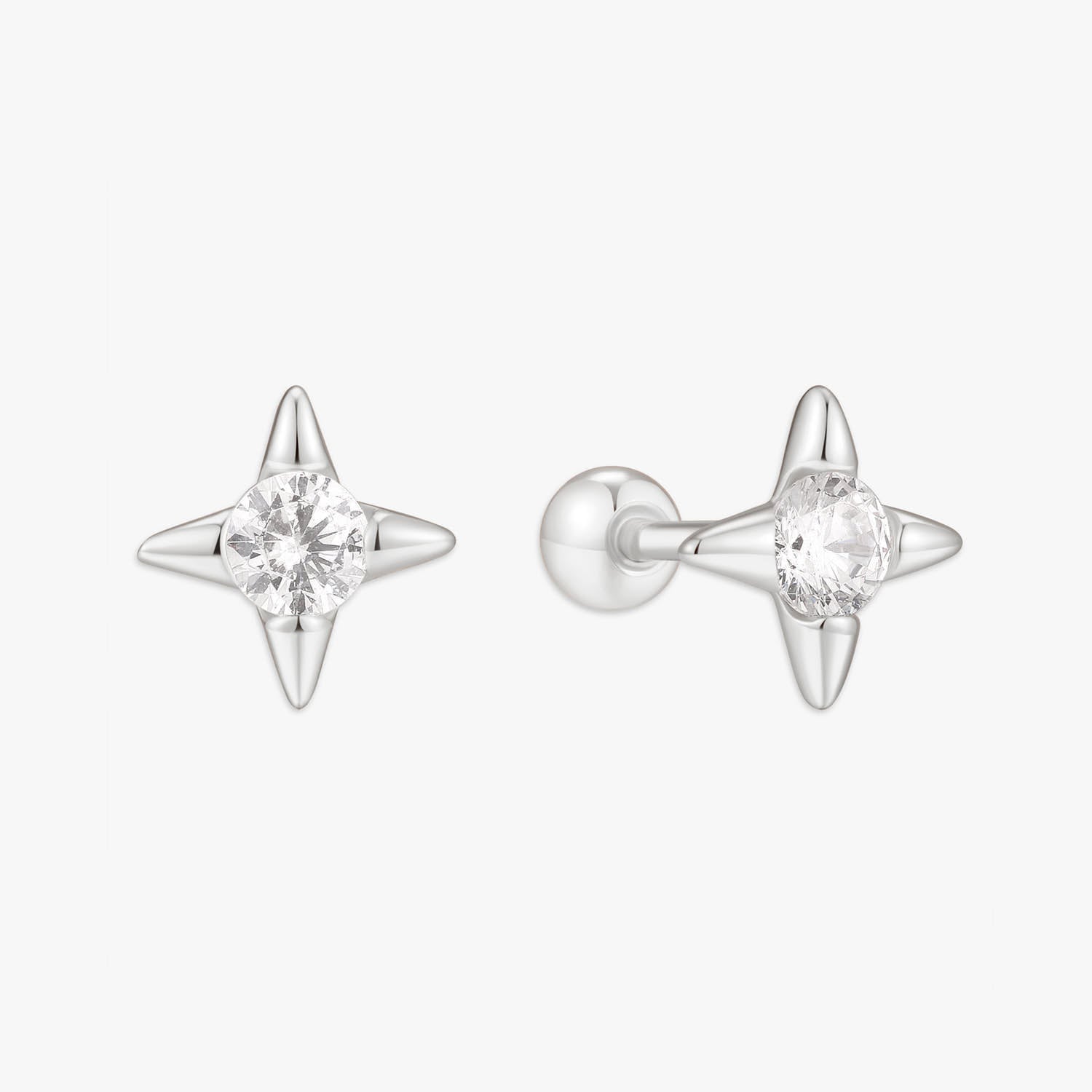 Star-shaped silver earrings with clear gemstones on a white background
