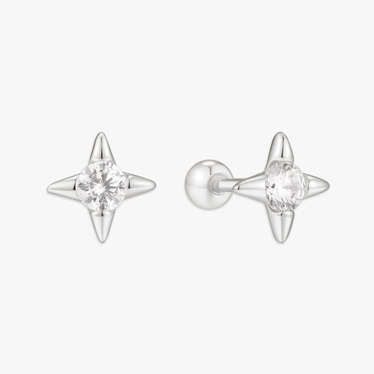 Star-shaped silver earrings with clear gemstones on a white background