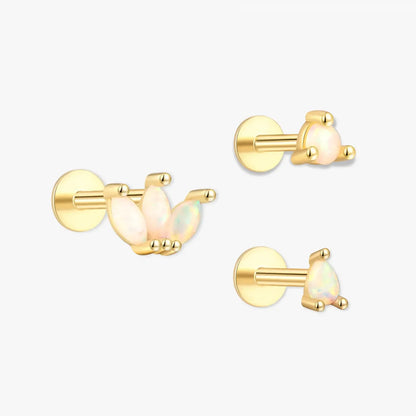 Gold and opal bird-shaped earrings on a white background
