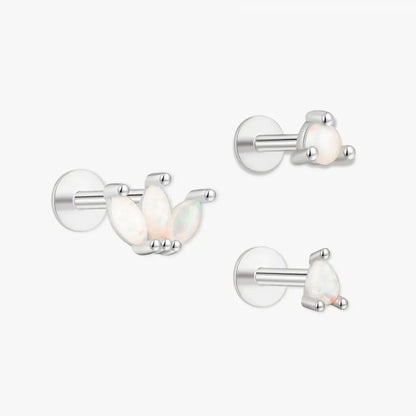 Set of silver earrings on a white background