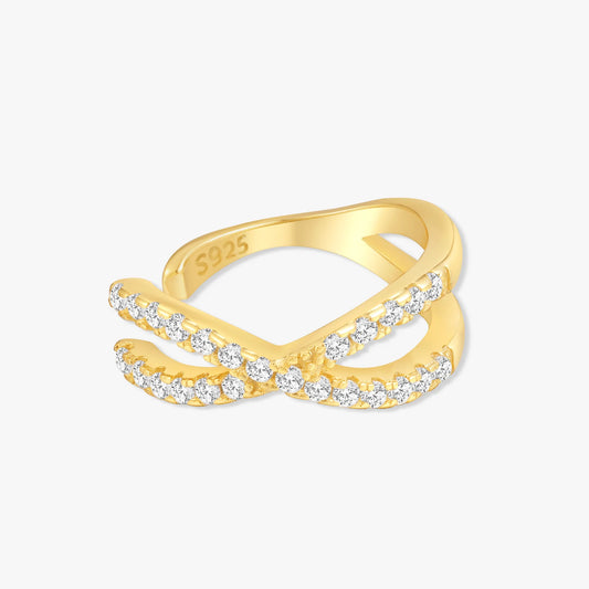 Gold ring with diamond accents on a white background