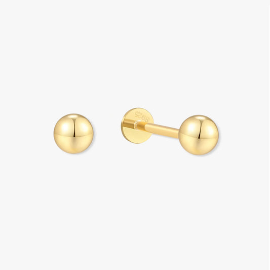 Pair of gold ball earrings on a white background