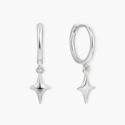 Pair of silver earrings with star-shaped drops on a white background