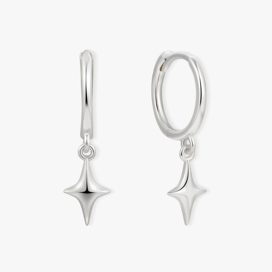 Pair of silver earrings with star-shaped drops on a white background