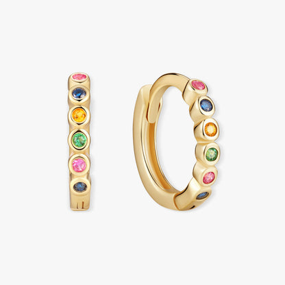 Gold hoop earrings with colorful gemstones on a white background