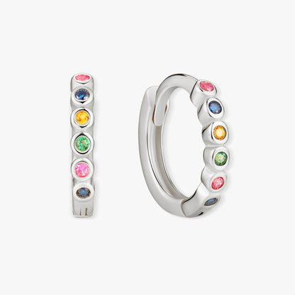 Silver hoop earrings with colorful gemstones on a white background