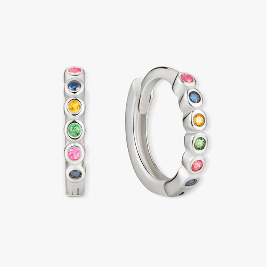 Silver hoop earrings with colorful gemstones on a white background
