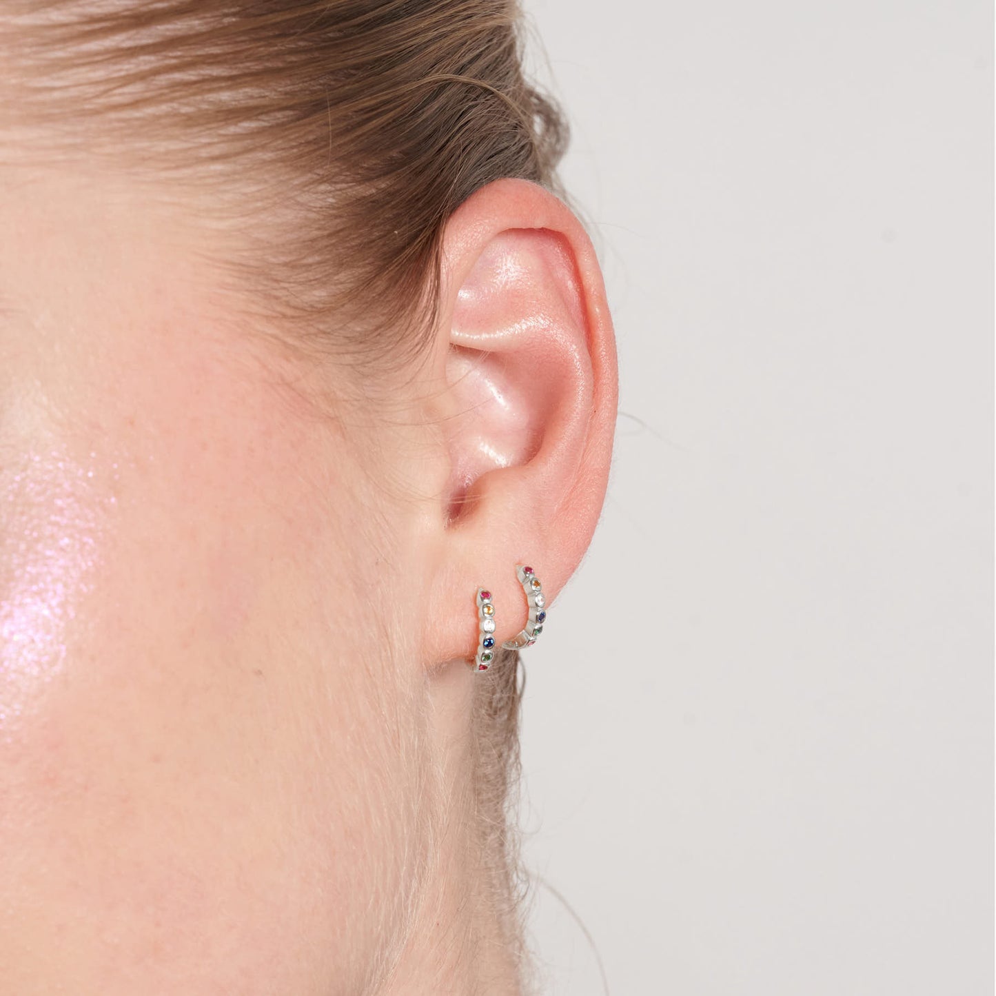 Rainbow Bezel Huggies In Silver