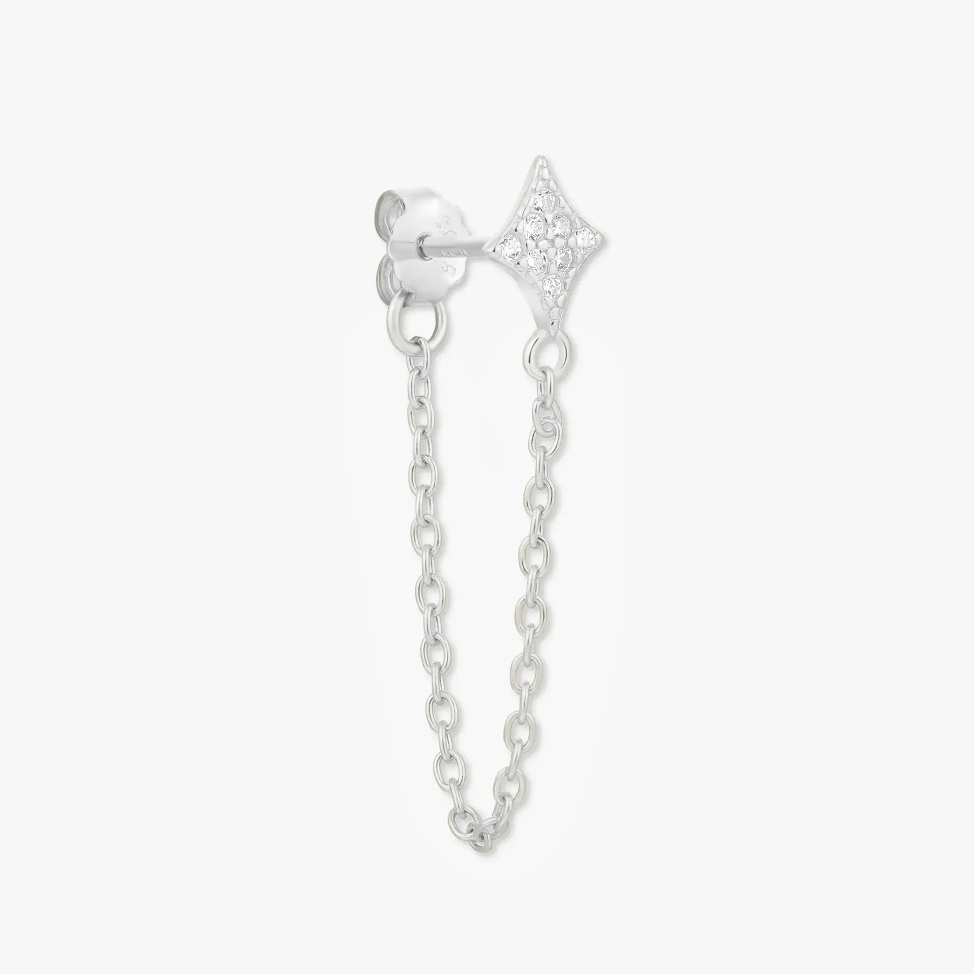 Silver earring with chain on a white background