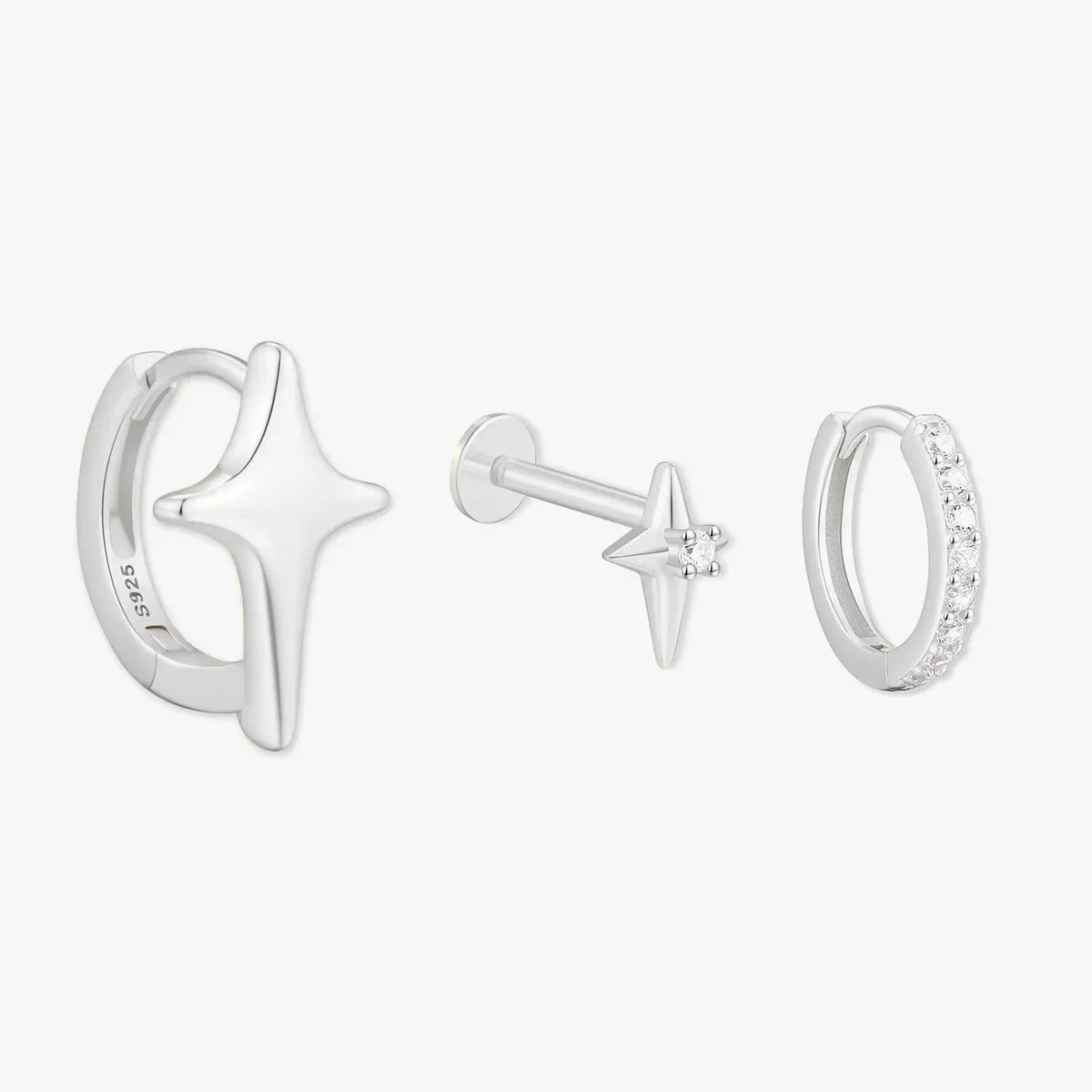 Set of silver earrings with star designs on a white background