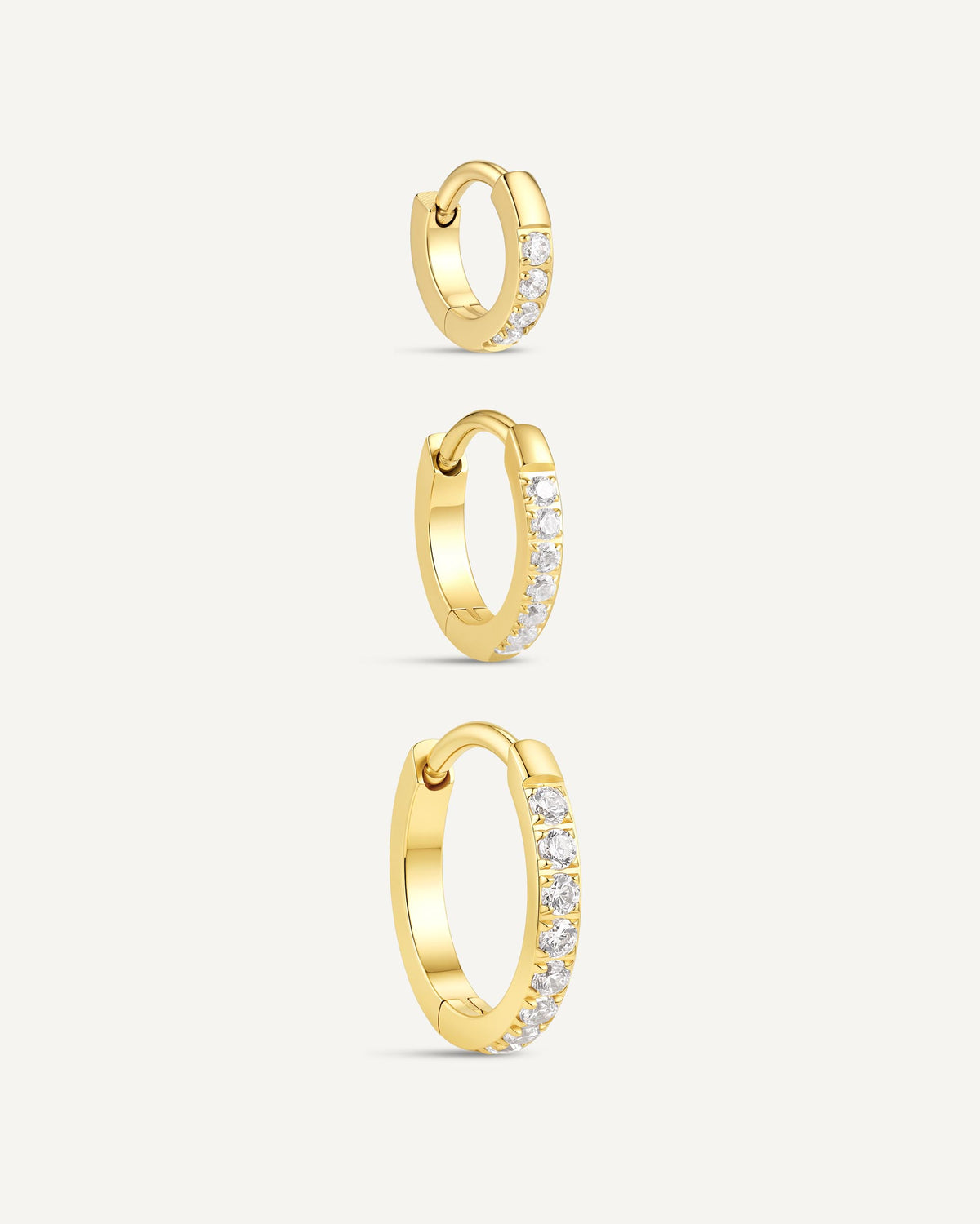 Crystal Paved Titanium Huggie Hoops In Gold