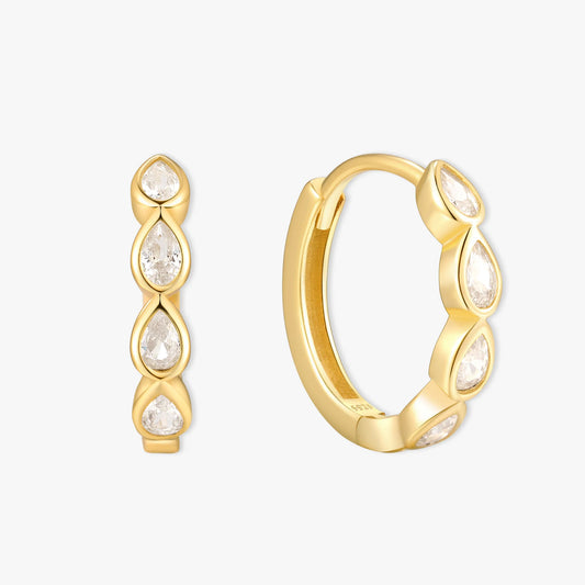 Gold hoop earrings with teardrop-shaped gemstones on a white background