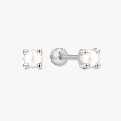Pair of pearl stud earrings with silver posts on a white background