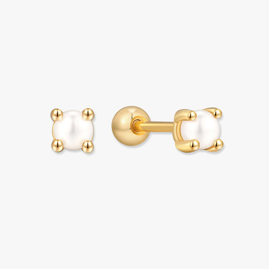 Gold earrings with white pearls on a white background