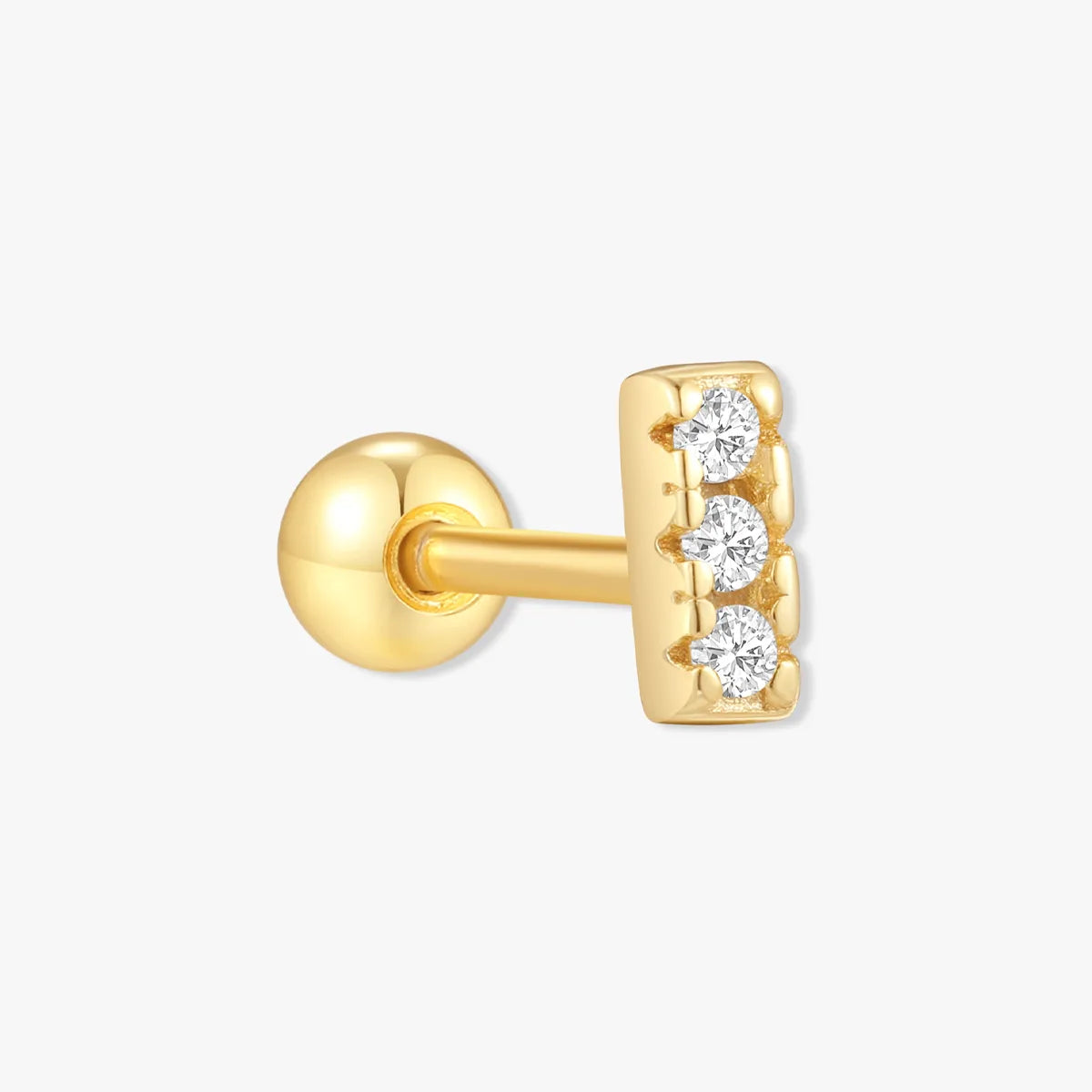 Gold earring with three diamonds on a white background