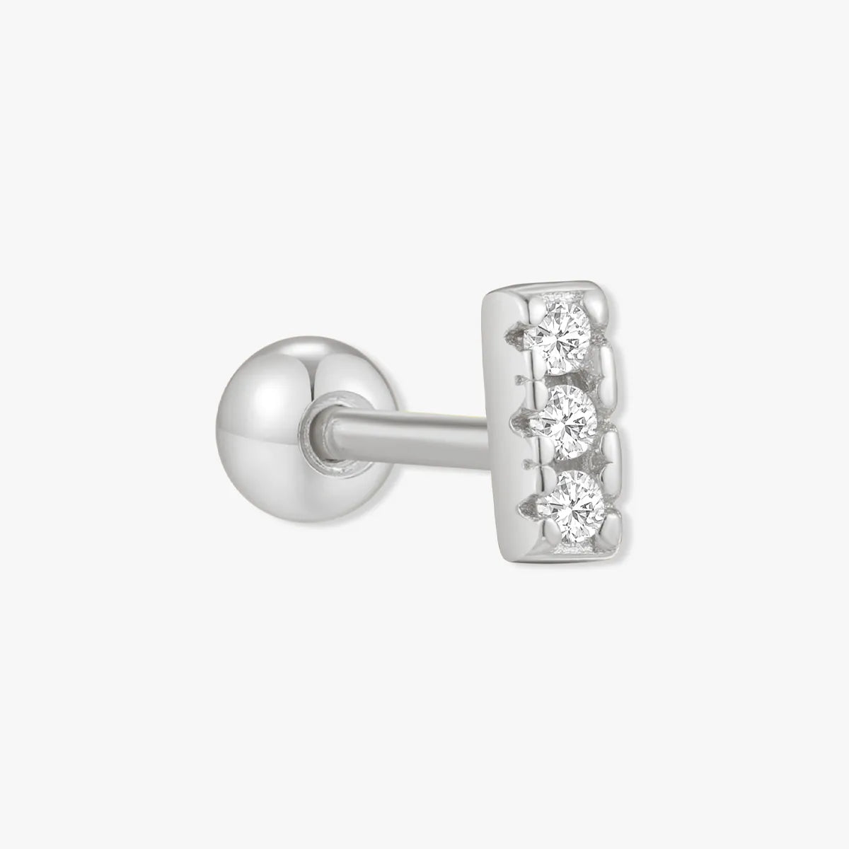 Silver stud earring with three clear gemstones on a white background