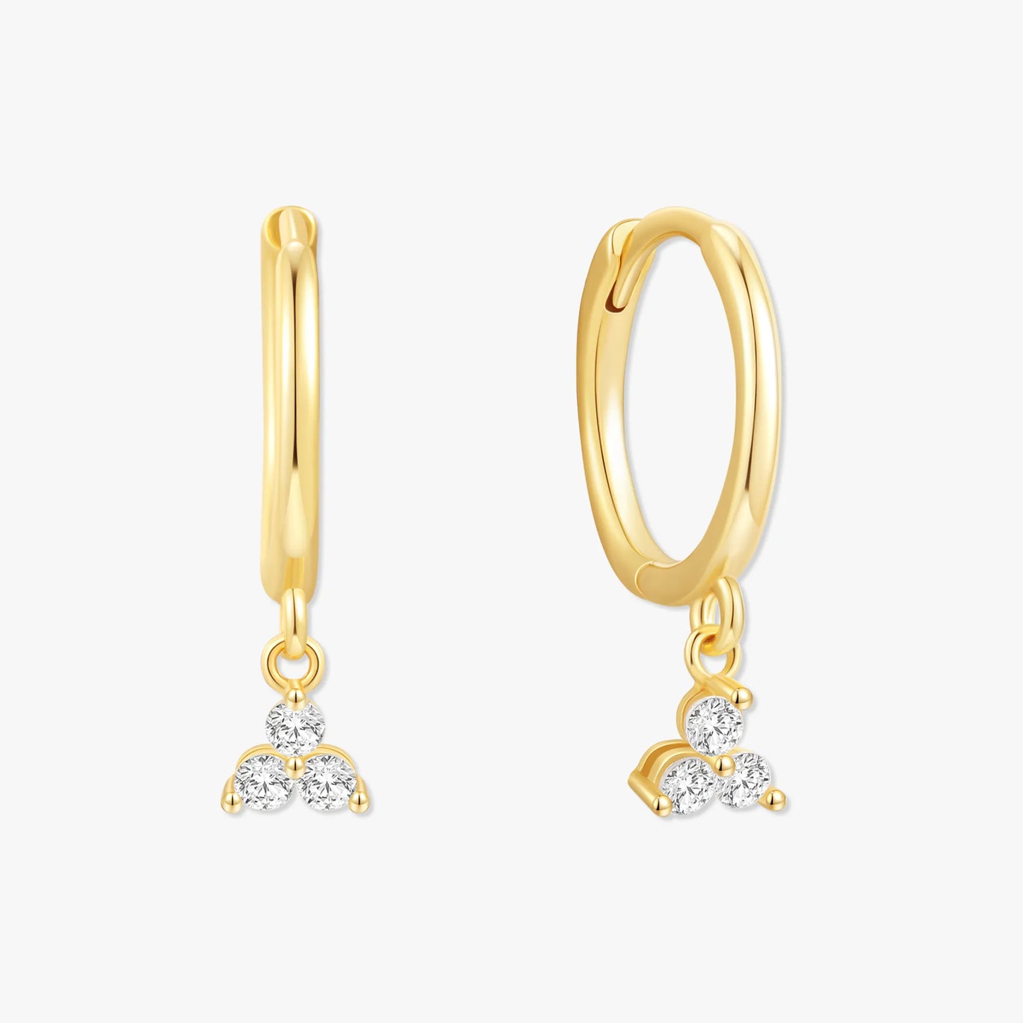 Gold hoop earrings with diamond pendants on a white background
