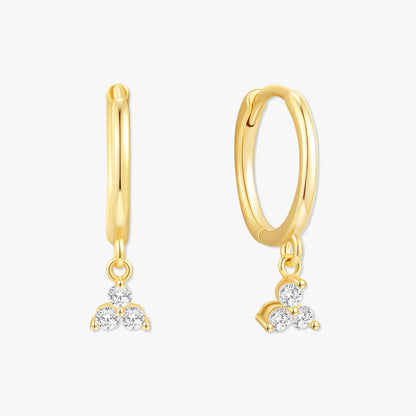Gold hoop earrings with diamond pendants on a white background