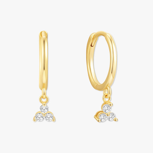 Gold hoop earrings with diamond pendants on a white background