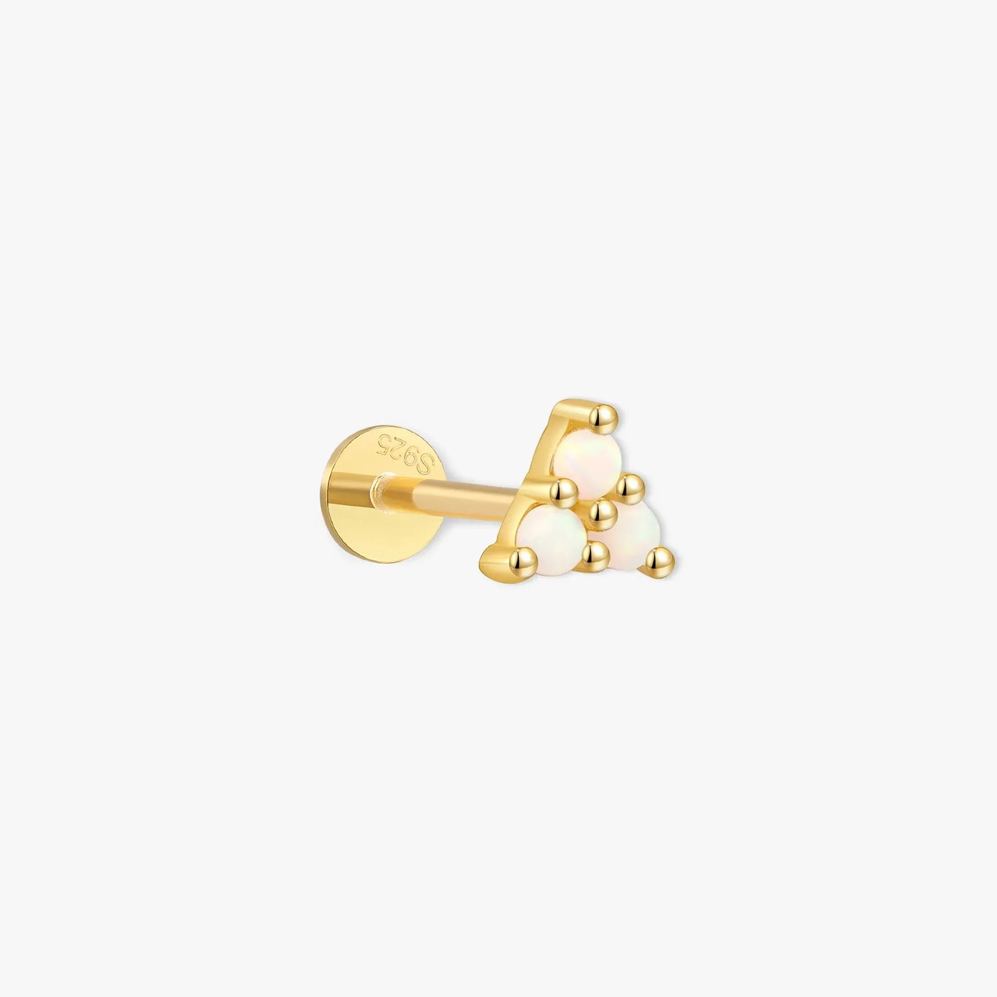 Gold earring with three white gemstones on a white background