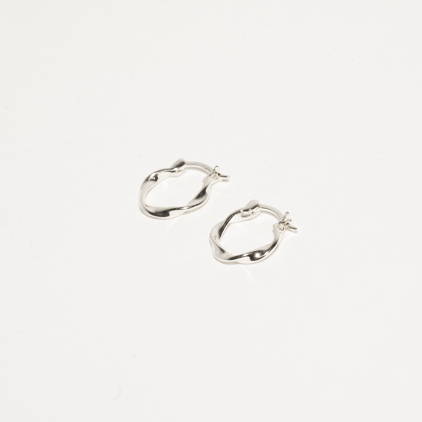 Twisted Hoop Earrings in Silver