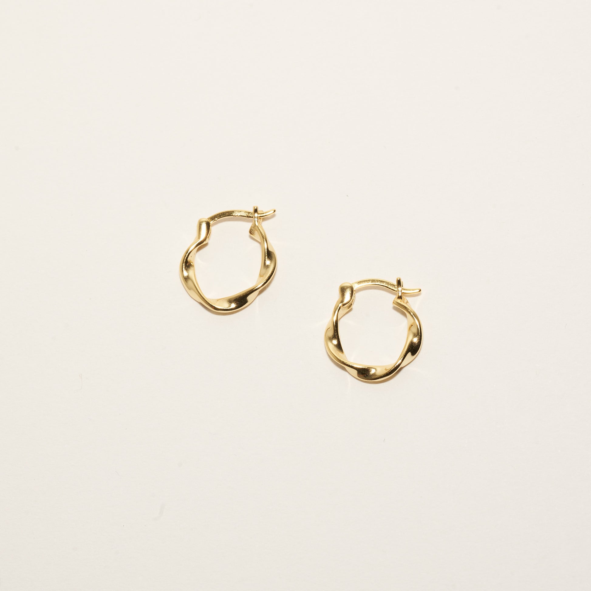 Twisted Hoop Earrings in Gold