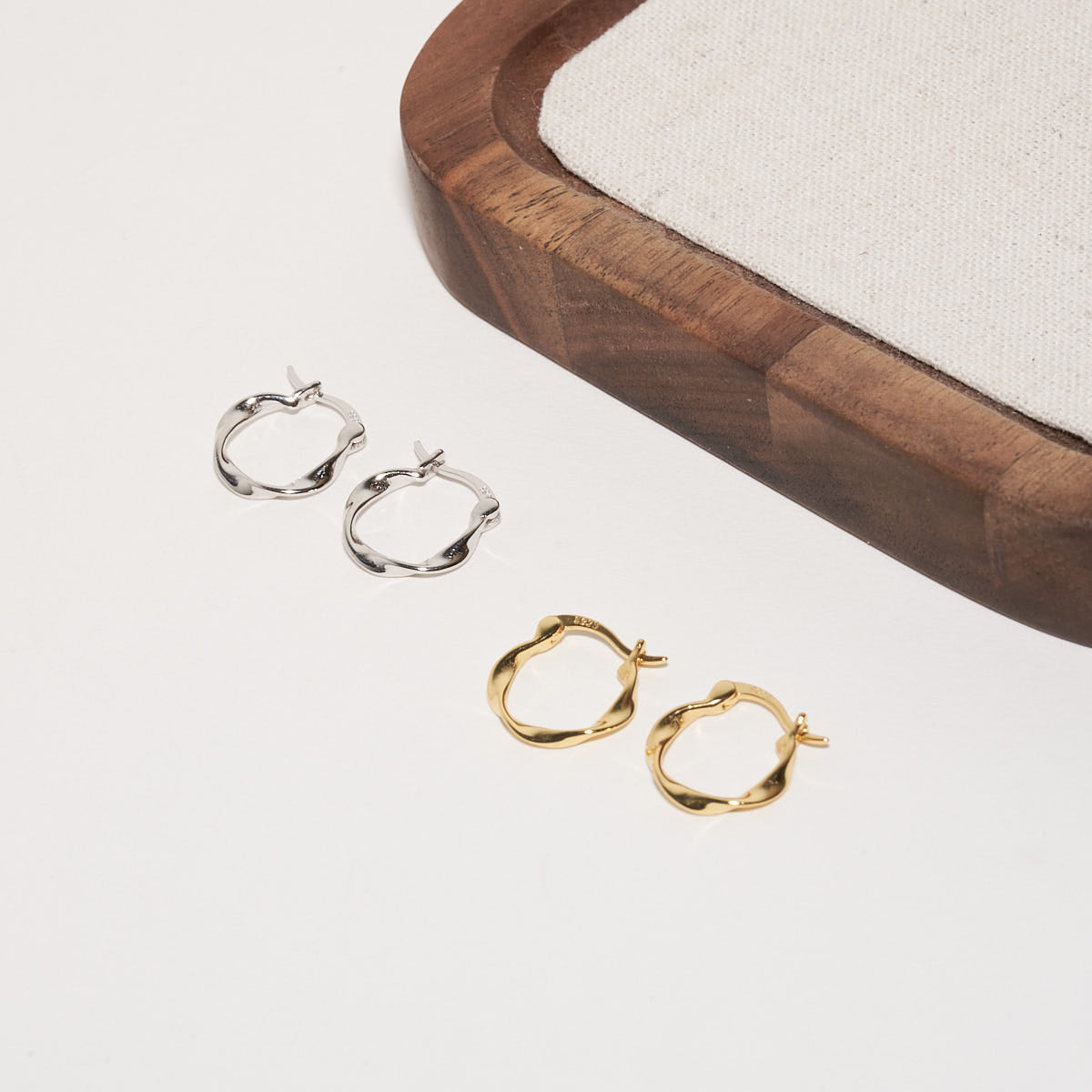 Twisted Hoop Earrings in Gold