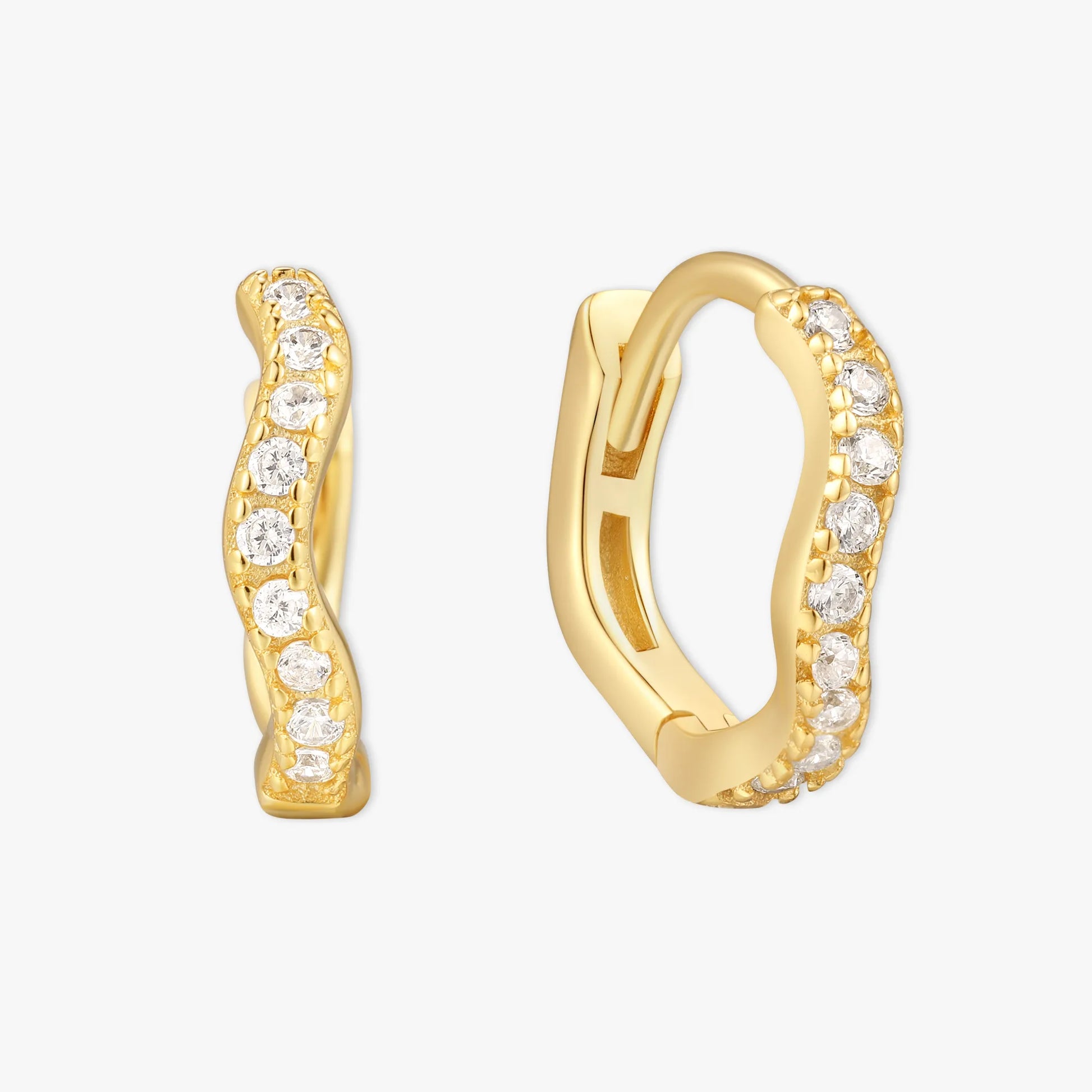 Gold hoop earrings with diamond accents on a white background