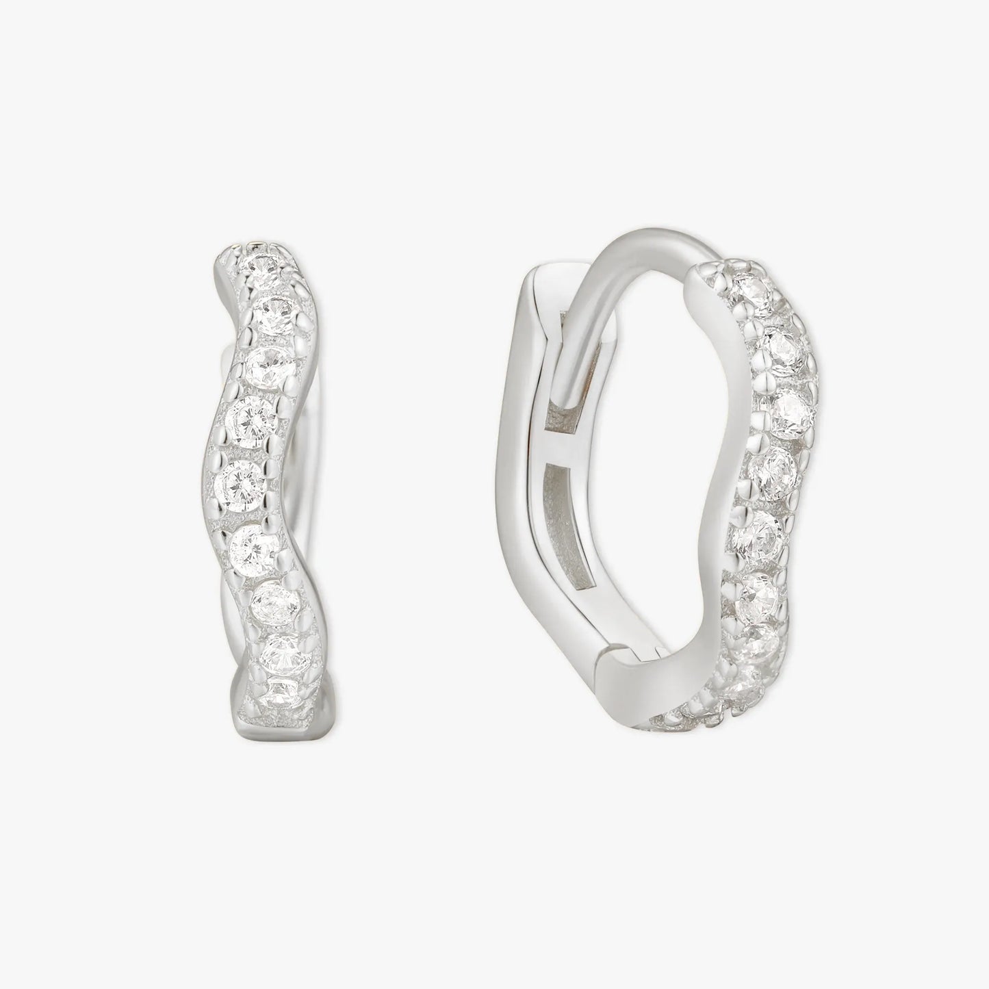 Silver hoop earrings with embedded stones on a white background